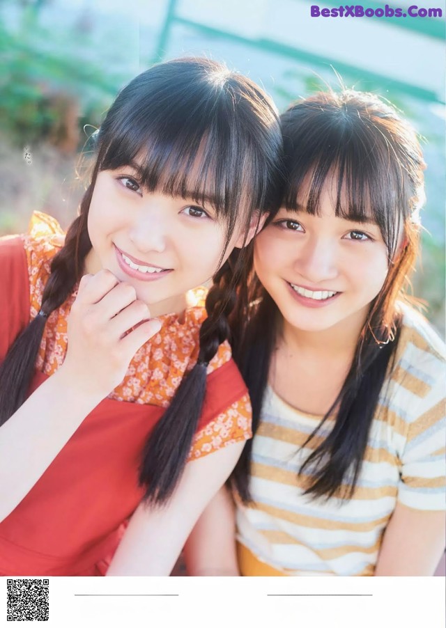 A couple of young women standing next to each other.