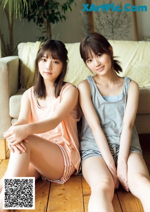 A magazine with two young women standing next to each other.