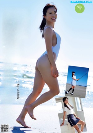 A woman in a white one piece swimsuit on the beach.